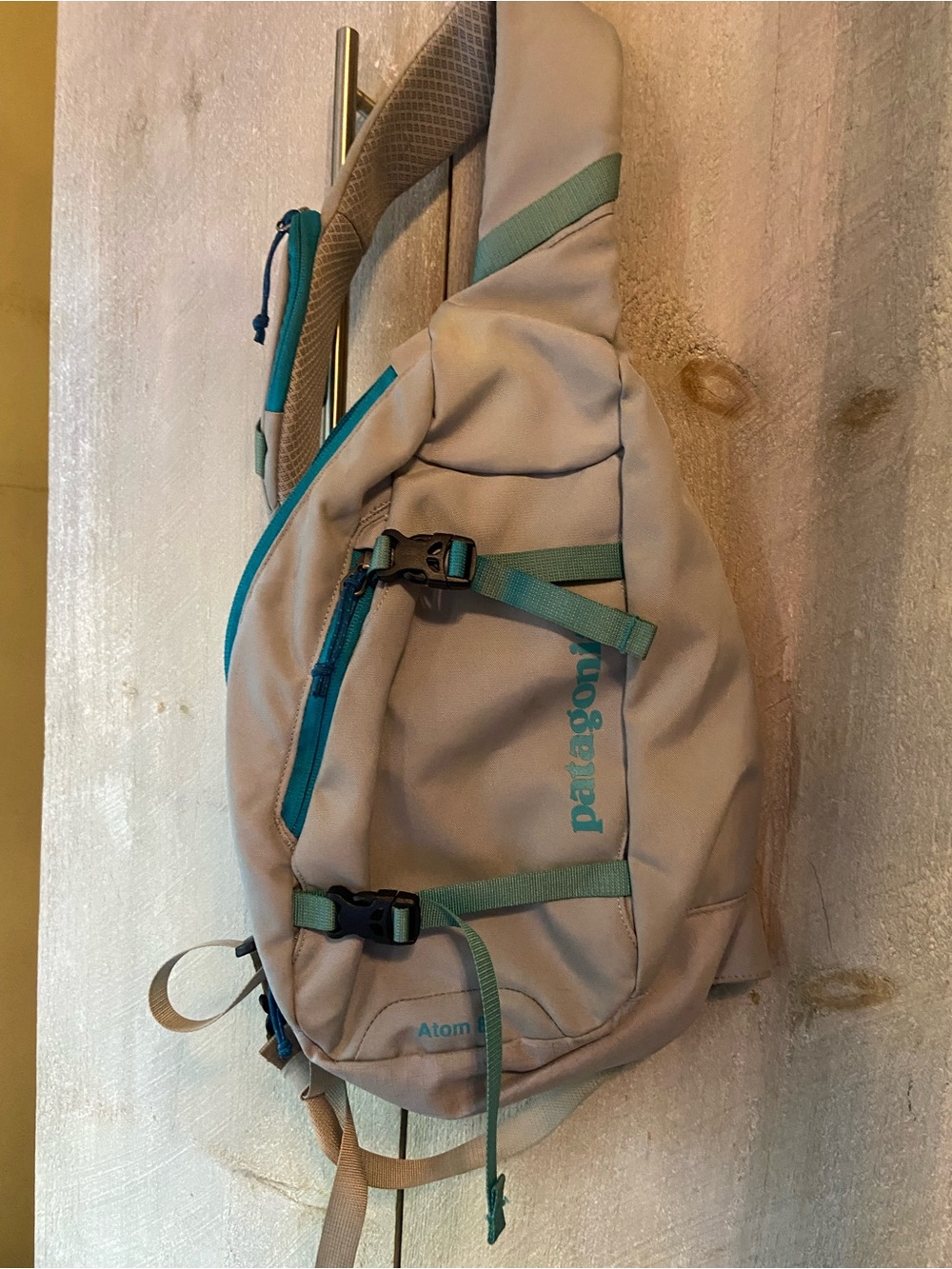 Patagonia Tan Sling Bag with Teal Accents